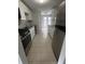 Modern kitchen with granite counters, white cabinets, and stainless steel appliances at 10630 Worthington Hills Mnr, Roswell, GA 30076