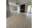 Spacious living room with tile floors and a cozy fireplace feature at 10630 Worthington Hills Mnr, Roswell, GA 30076