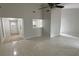 Bright living room featuring tile flooring, neutral paint, and ceiling fan at 10630 Worthington Hills Mnr, Roswell, GA 30076