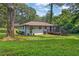 Large, tree-lined backyard with deck, perfect for outdoor entertaining and relaxation at 1769 W Austin Rd, Decatur, GA 30032