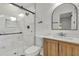 Bathroom featuring black framed glass shower and modern vanity with a black framed mirror at 1769 W Austin Rd, Decatur, GA 30032