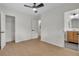 Bright bedroom featuring light wood floors, ceiling fan, closet, and connecting bathroom at 1769 W Austin Rd, Decatur, GA 30032