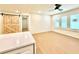 Bonus room with natural light, a barn door, and wood flooring at 1769 W Austin Rd, Decatur, GA 30032