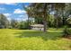 Charming home featuring a large front yard with mature trees and lush green grass at 1769 W Austin Rd, Decatur, GA 30032