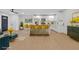 Open-concept living space featuring a modern kitchen with a breakfast bar and adjacent dining area at 1769 W Austin Rd, Decatur, GA 30032