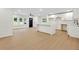 Bright living room with white cabinets, wood flooring, a black front door, and lots of natural light at 1769 W Austin Rd, Decatur, GA 30032