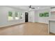Bright living room with wood floors, white walls, a black front door, and lots of natural light at 1769 W Austin Rd, Decatur, GA 30032