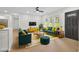 Bright, stylishly staged living room with lots of natural light, modern furnishings, and open layout at 1769 W Austin Rd, Decatur, GA 30032