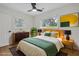 Calm bedroom with neutral walls, hardwood floors, and a large window providing natural light at 1769 W Austin Rd, Decatur, GA 30032
