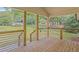 Inviting wooden back porch with metal railings and serene outdoor views at 2128 Kimberly Rd, Atlanta, GA 30331