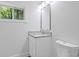 Bright bathroom features new vanity, granite counters and fixtures at 2128 Kimberly Rd, Atlanta, GA 30331
