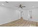 Spacious bedroom featuring hardwood floors, ceiling fan, and abundant natural light at 2128 Kimberly Rd, Atlanta, GA 30331