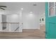 Inviting entryway with stylish railing, light floors, and bright blue front door at 2128 Kimberly Rd, Atlanta, GA 30331