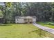 Charming home featuring a freshly landscaped yard, long driveway, and inviting front porch at 2128 Kimberly Rd, Atlanta, GA 30331