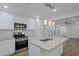 Eat-in kitchen offers an island with granite countertops and stainless-steel appliances at 2128 Kimberly Rd, Atlanta, GA 30331