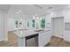 Bright kitchen boasts granite counters, stainless steel appliances, and an island with pendant lighting at 2128 Kimberly Rd, Atlanta, GA 30331