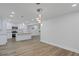 Bright kitchen boasts granite counters, stainless steel appliances, and an island with pendant lighting at 2128 Kimberly Rd, Atlanta, GA 30331