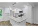 Modern kitchen with granite countertops, a kitchen island, and new appliances at 2128 Kimberly Rd, Atlanta, GA 30331