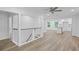 Open floor plan with living room, kitchen, new floors, and modern finishes at 2128 Kimberly Rd, Atlanta, GA 30331