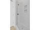 The bright, modern shower features sleek tile, modern fixtures and a niche at 2128 Kimberly Rd, Atlanta, GA 30331