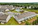 Aerial view of community featuring swimming pool, clubhouse and neighborhood street at 2629 Irwell Way, Lawrenceville, GA 30044