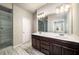 Bathroom with dual sinks, sleek counters, and a glass-enclosed walk-in shower at 2629 Irwell Way, Lawrenceville, GA 30044