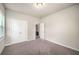 Well-lit bedroom featuring plush carpet and an ensuite bathroom at 2629 Irwell Way, Lawrenceville, GA 30044