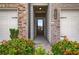 Inviting front entrance with decorative shrubs and a view of the 2-car garage at 2629 Irwell Way, Lawrenceville, GA 30044