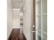 Hallway with hardwood floors, neutral walls, and views to the Gathering room at 2629 Irwell Way, Lawrenceville, GA 30044