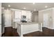 Modern kitchen with white cabinetry, granite countertops, and stainless steel appliances at 2629 Irwell Way, Lawrenceville, GA 30044