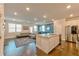 Spacious kitchen with granite island, stainless steel appliances, and open view into the living room at 2629 Irwell Way, Lawrenceville, GA 30044