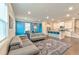 Open-concept with a kitchen island, stainless appliances, and hardwood floors at 2629 Irwell Way, Lawrenceville, GA 30044