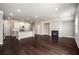 Open-concept living space with hardwood floors and fireplace at 2629 Irwell Way, Lawrenceville, GA 30044