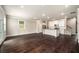 Large open-plan living area with hardwood floors and a modern kitchen at 2629 Irwell Way, Lawrenceville, GA 30044