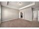 Spacious main bedroom featuring plush carpeting and a doorway to the Primary bath at 2629 Irwell Way, Lawrenceville, GA 30044
