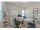 Home office with built-in bookshelves, desk, and natural light at 2629 Irwell Way, Lawrenceville, GA 30044