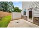 A small outdoor patio features a privacy fence and easy access to the home's backyard at 2629 Irwell Way, Lawrenceville, GA 30044