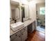 Bathroom vanity with granite countertop, modern sink, dark hardware and framed mirror at 5254 Corinth Dr, Stone Mountain, GA 30087