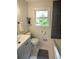 Bathroom features a modern design, a large mirror and updated vanity at 5254 Corinth Dr, Stone Mountain, GA 30087