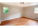 Bedroom features hardwood floors, neutral walls, natural light, and a closet at 5254 Corinth Dr, Stone Mountain, GA 30087