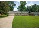 Charming single-story home with brick accents, lush lawn, and welcoming walkway at 5254 Corinth Dr, Stone Mountain, GA 30087
