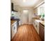 Stylish kitchen with wooden countertops, stainless steel appliances, and white cabinetry at 5254 Corinth Dr, Stone Mountain, GA 30087