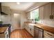 Updated kitchen with wooden countertops, stainless steel appliances, and white cabinets at 5254 Corinth Dr, Stone Mountain, GA 30087