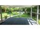 Screened porch with view of beautiful backyard, patio, and pool area at 5254 Corinth Dr, Stone Mountain, GA 30087