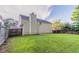 Well-maintained backyard with a large lawn and privacy fencing at 6528 Carriage Ln, Stone Mountain, GA 30087