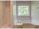 Bright bathroom featuring separate tub and shower at 6528 Carriage Ln, Stone Mountain, GA 30087