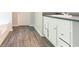 Bright bathroom featuring vinyl flooring and a white vanity at 6528 Carriage Ln, Stone Mountain, GA 30087
