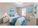 Comfortable bedroom with nautical decor, soft lighting, and a cozy bed at 6528 Carriage Ln, Stone Mountain, GA 30087