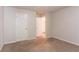 Neutral bedroom featuring carpeting and white doors at 6528 Carriage Ln, Stone Mountain, GA 30087