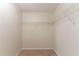 Walk-in closet featuring built-in shelving at 6528 Carriage Ln, Stone Mountain, GA 30087